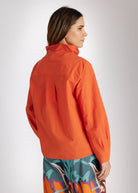 Bluse BLYZANTIS mit Kelchkragen, langen Ärmeln und kastiger Form in Orange